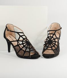 Watch them quiver, dears! Trap your prey in these eye-catching heels from Unique Vintage, boasting a jaw-dropping spider web vamp in black faux suede and sheer mesh. These heels come with peep toes and an adjustable ankle strap while the 3.5 inch heel and cushion insole keeps them in your grasp!.Please note there is a 10% restocking fee if you choose to return.. Available while supplies last. | Unique Vintage 1940S Black Spider Web Heels | Size 6 Spider Shoes Heels, Cobweb Shoe, Cobweb Shoes, Spider Clothes, Spooky Wedding, Medusa Costume, Halloween Shoes, Goth Shoes, Corporate Goth