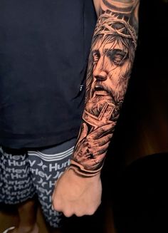 a man with a tattoo on his arm