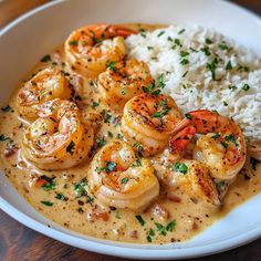 a white plate topped with shrimp and rice