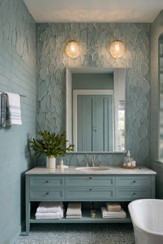 a bath room with a tub and a mirror