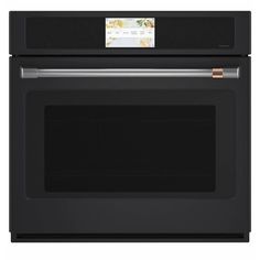 a black oven with the door open and a white label on it's side