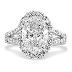 an oval cut diamond ring with double halos