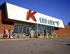 the front of a kmart store with an empty parking lot