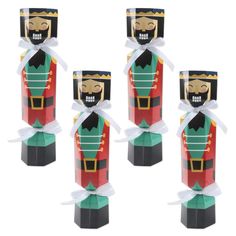 four wooden nutcrackers with white ribbons on them