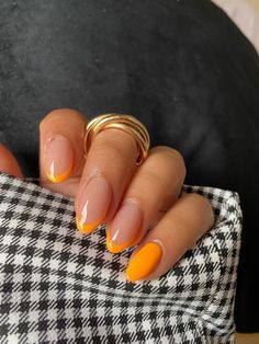 As much as I love the basic nail colors, there's something about bright nails that just makes me happy. Right now, I'm specifically loving orange nails! From neon orange to burnt orange, there's literally a Light Orange Nails With Design, Round Nail Designs Spring, Nail Ideas Beach Vacation, Orange Accent Nails, Neon Almond Shaped Nails, Nails Inspo Orange, Short French Nails Color, Colored Tips Nails, Orange Tip Nails