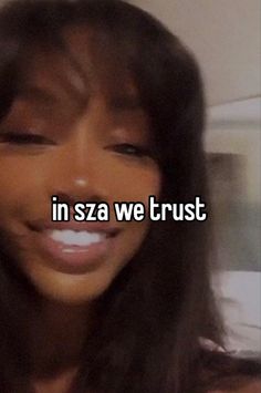 a woman with long hair smiling and the words in sza we trust on her face