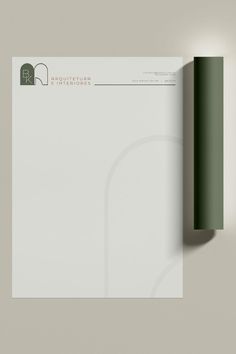 an image of a letterhead and business card on a white background with green accents