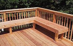 a wooden bench sitting on top of a wooden deck