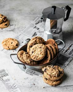 chocolate chip cookies in a bowl next to a coffee pot