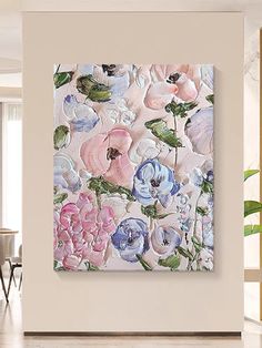 an abstract floral painting hangs on the wall