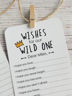 two tags that say wishes for our wild one