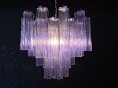 a purple chandelier hanging from a ceiling