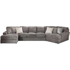 a large sectional couch with pillows on the top and bottom corner, in grey fabric