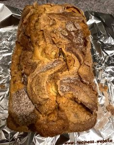 a loaf of bread sitting on top of aluminum foil