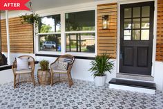 two wicker chairs sitting on the front porch next to a black door and window