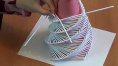 someone is making a sculpture out of paper