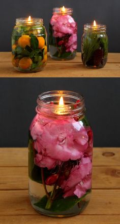 three jars filled with flowers and candles on top of a wooden table next to each other