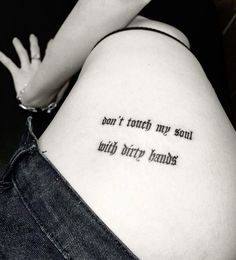 a woman with a tattoo saying don't touch my soul, only dirty hands