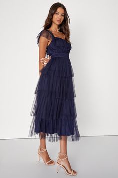 Make an entrance that everyone will love in the Lulus Tier I Come Navy Blue Tulle Square Neck Tiered Midi Dress! Airy tulle shapes this oh-so-sweet dress that features a square neckline, accented by a tying keyhole cutout and a flouncy overlay that flows into fluttery, elasticized straps. Slightly gathered bodice sits atop an elasticized, smocked waist that falls to a tiered skirt that ends at a midi hem. Hidden side zipper/clasp. Fit: This garment fits true to size. Length: Mid-calf length. Siz Blue Sheer Midi Dress For Party, Summer Mesh Dress With Tulle Skirt, Party Dresses With Tulle Skirt And Mesh Material, Sleeveless Tulle Midi Dress With Ruffles, Summer Tulle Midi Dress With Ruffles, Summer Cocktail Tulle Midi Dress, Sleeveless Mesh Dress With Ruffles, Summer Midi Dress With Ruffles In Light Fabric, Blue Tiered Tulle Dress