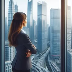 a business woman looking out the window at cityscape