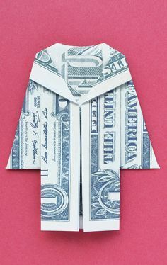 an origami shirt made out of money on a pink background with red paper