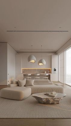 a living room with couches, tables and lamps