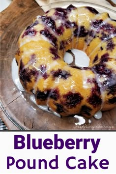 a blueberry pound cake on a plate with the words blueberry pound cake above it