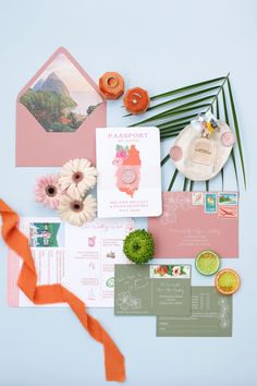 the wedding stationery is laid out on top of each other