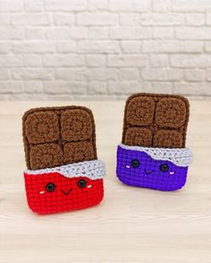 two crocheted toasters sitting on top of a table