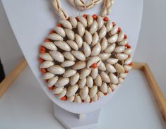 fantastic art work! a real piece of art! Enormous Papua New Guinea tribal COWRIE SHELL ceremonial statement NECKLACE with huge crocheted circular medallion pendant with some small orange painted shells ; medallion : 4.5'' inches DIAMETER; 31'' INCHES without the medallion ; 151 gr  good vintage condition with imperfections expected from a handcrafted item made of organic material - sold as is. IMPORTANT TO READ: To make this a smooth and pleasant transaction experience for everyone, all buyers need to read and understand the description, the terms of sale , the payment and the shipping indicated in this listing. TERMS OF SALE A. SHIPPING WORLDWIDE This listing includes the shipping fees indicated below. B. CARRIERS We don't ship with FedEx, DHL or UPS or any other carrier except for Canada African Necklaces, Pendant Necklace Vintage, African Necklace, Painted Shells, Orange Paint, New Guinea, Cowrie Shell, Fantastic Art, Art Styles