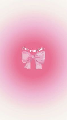 a pink bow with the words live, your life on it's side in white lettering