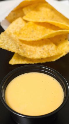 some tortilla chips and a bowl of dip