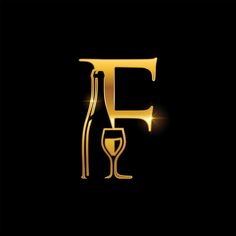 the letter f is made up of gold letters and a glass with wine in it