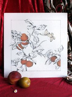 a card with fruit on it sitting next to a pair of scissors