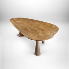 an oval shaped wooden table with two legs on one side and a triangular shape on the other