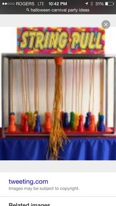 a colorful display with beads and toys on it's sides, including a sign that says string pull