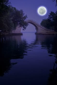 a full moon is seen over the water in this artistic photo taken from a boat