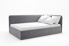 a gray couch with white pillows on it and a pillow in the back ground, against a white background