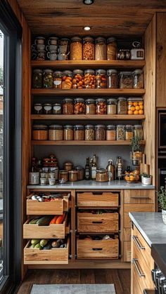 a kitchen with lots of wooden shelves filled with food and containers on top of them