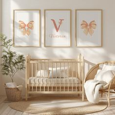 a baby's room with three framed pictures on the wall and a wicker rocking chair