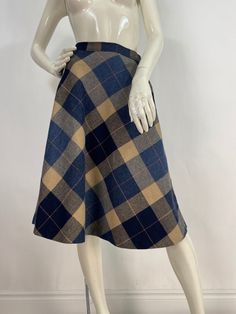 Plaid midi skirt, vintage midi skirt, size 26" waist  Measurements:  Waist 13"/hip 19"/bottom width (corner-corner)41"/length 26" Mannequin measurements:  5'8", bust 34", waist 25", hip 33" Please note that vintage clothing sizes can vary greatly.  The Measurements provided  are approximate and are taken lying flat.  I suggest taking a similar garment from your wardrobe and measure it while lying flat.  This way you can compare measurements.   Don't forget to enlarge the photos and take a closer Retro A-line Winter Skirt, Fall Midi-length Lined Pencil Skirt, Fall Midi Length Lined Pencil Skirt, Fitted Midi Skirt For Fall, Classic Fall Midi Skirt, Classic Knee-length Skirt For Fall, Retro Winter Skirt, Classic Full Skirt Bottoms For Fall, Fitted Knee-length Skirt For Fall