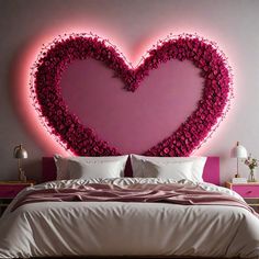 a heart shaped bed with pink flowers on the headboard and pillows in front of it