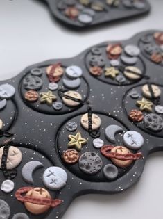 a close up of a tray with buttons and other things on it, including stars