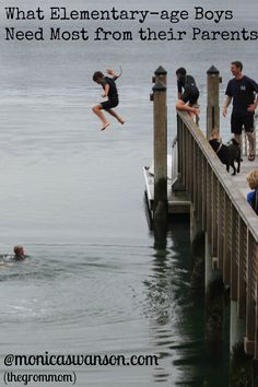 a group of people standing on top of a pier