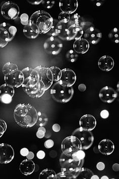 soap bubbles are floating in the air