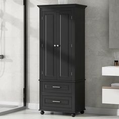 a tall black cabinet in a bathroom next to a shower