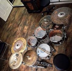 a drum set sitting on top of a hard wood floor