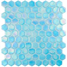 blue and white hexagonal glass mosaic tile on a white background, with an irregular pattern