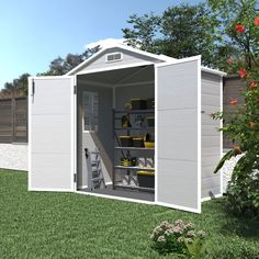 a white shed with the door open and tools in it's storage compartment outside