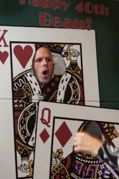 a man is making a face while playing cards